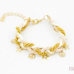 ivory and gold braided bracelet wit..